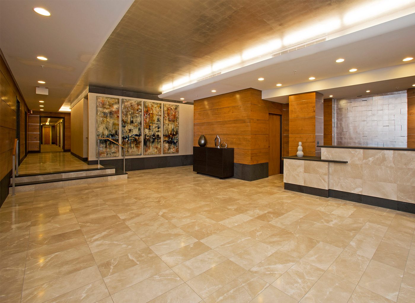 Tile floors and wood panelling in front of welcome desk