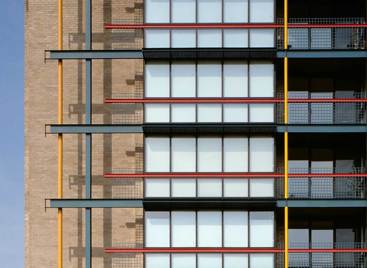 Close up of exterior of building with red and yellow accents
