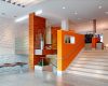 Allegro interior with bright orange accent walls