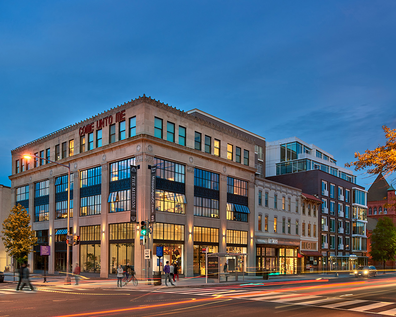 Stately building light up from the inside at sunset