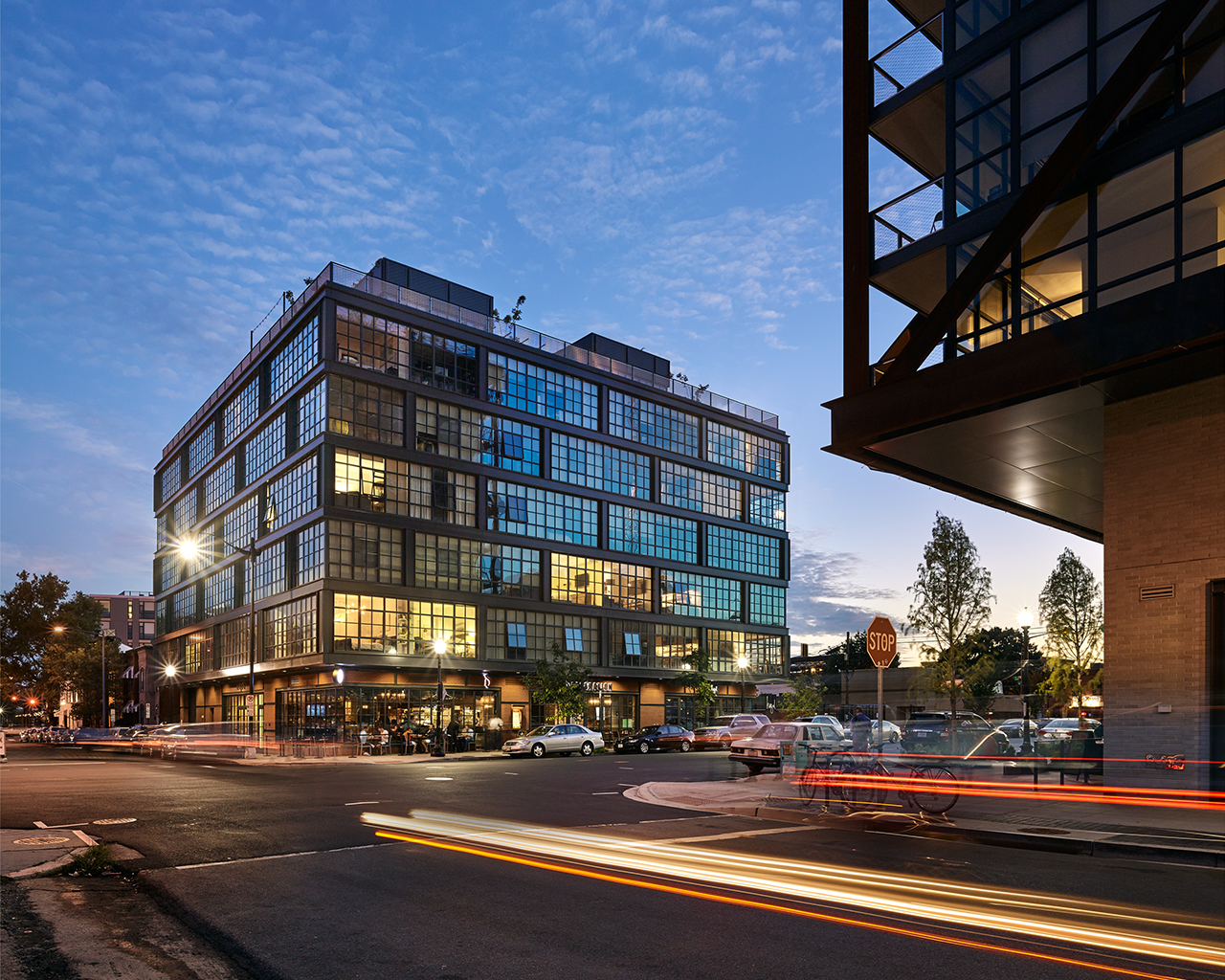 Exterior of building with many windows at sunset