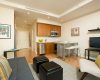 Brightly lit kitchen and living room
