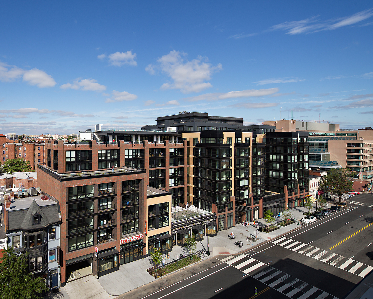Brightly lit exterior of large building in the middle of the city