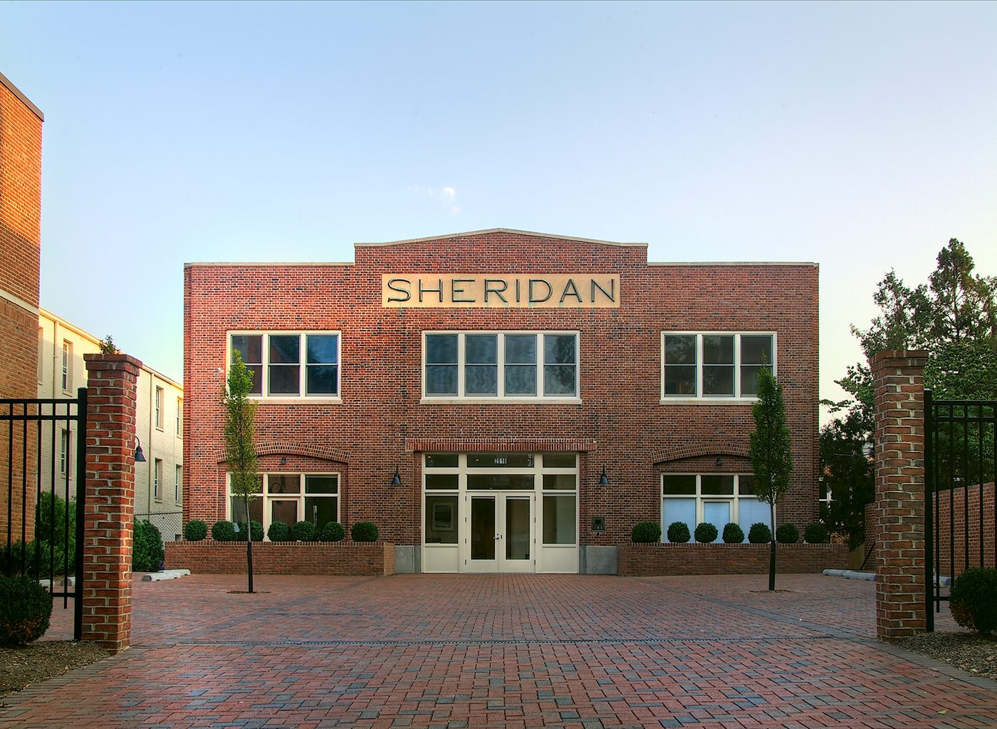 Exterior of brick building with large type reading Sheridan above center windows