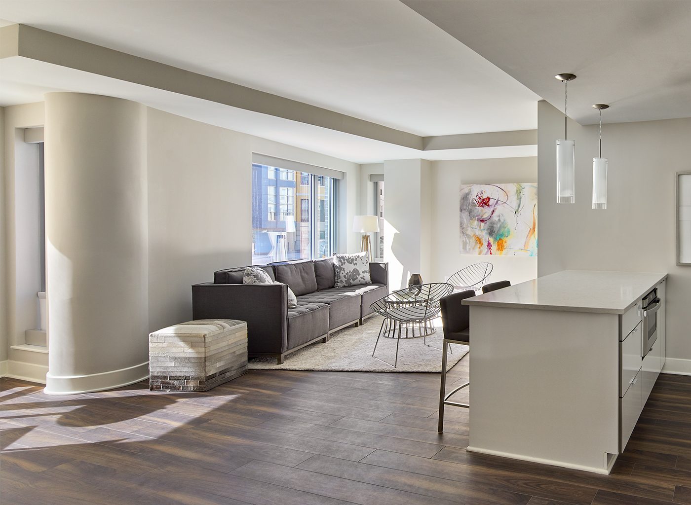White interior of apartment complex with modern art and furniture