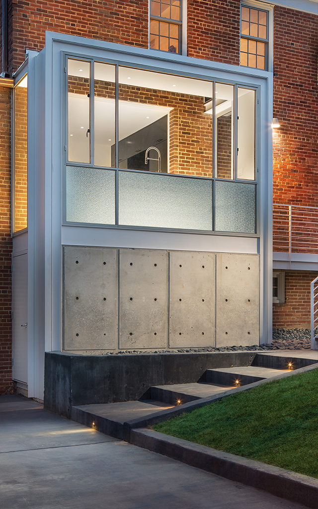 View from outside of modern kitchen on stately brick building