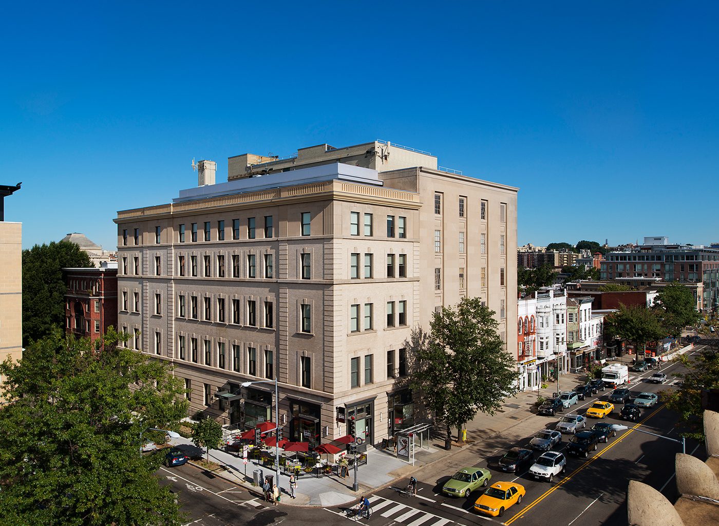 Stone building on busy city street