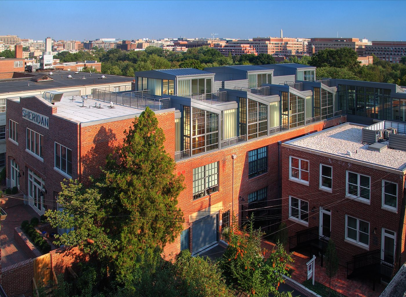 Exterior view of brick buildings with windows on top