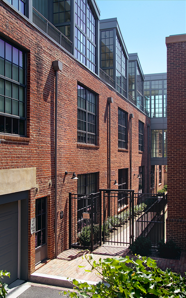 Courtyard of brick building with bushes