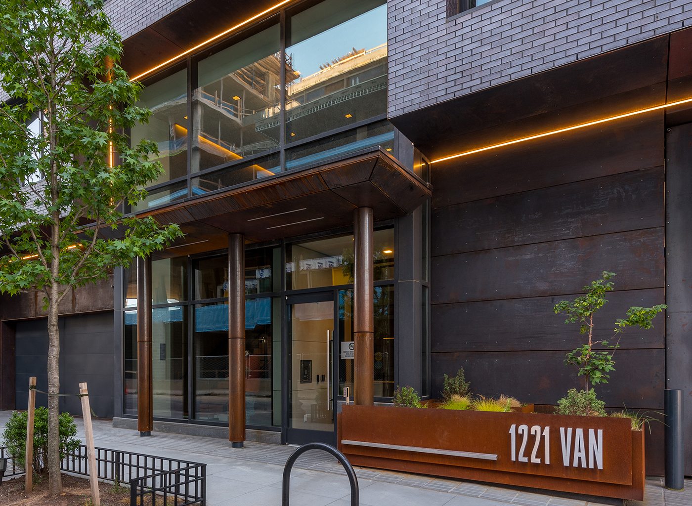 Exterior of modern apartment complex with wood and brick
