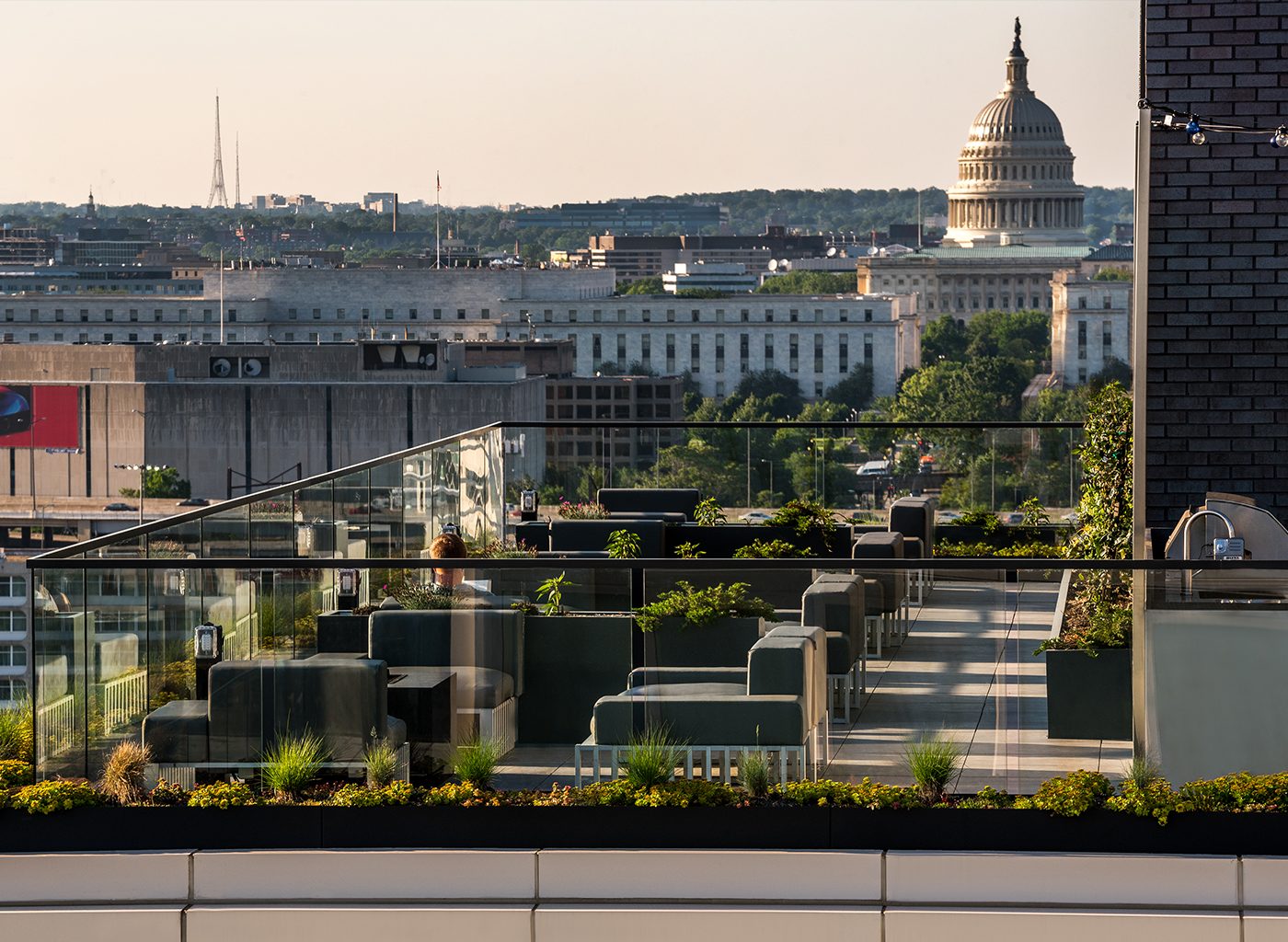 View from rooftop with black couches in daytime